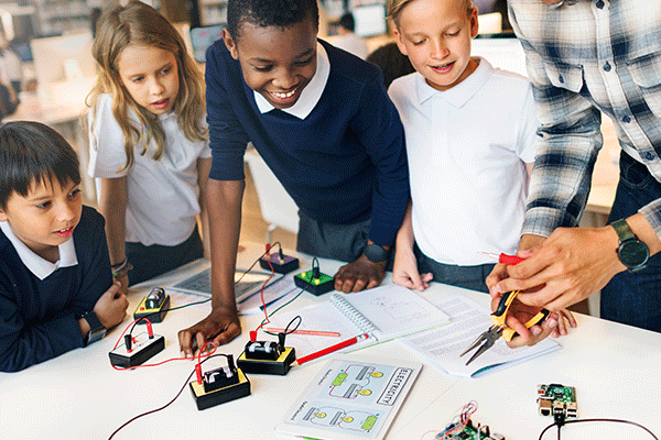 Children at school testing electronics