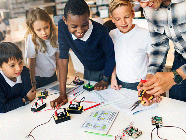 Children at school testing electronics