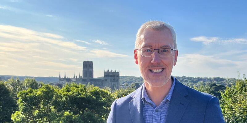 Photo of Martyn Stenton with a view of Durham Cathedral in the background