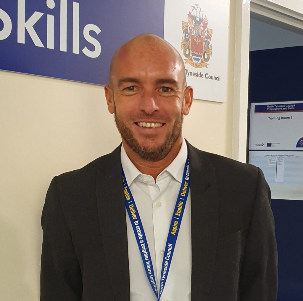 A colour photograph of Mark Barrett
