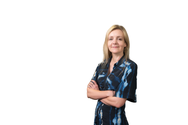 Photograph of Annabel Bates, smiling with arms crossed